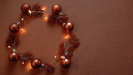This beautiful Christmas wreath features brown ornaments and soft lights, creating a warm and cozy atmosphere perfect for holiday decorations and celebrations.の素材