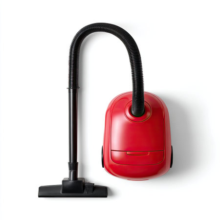 A vibrant red vacuum cleaner designed for home use, featuring a flexible hose and multiple attachments for efficient cleaning across various surfaces and spaces.の素材