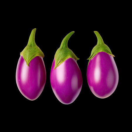 This stunning image features three fresh, vibrant purple eggplants with glossy skin and green leaves, set against a black background. Ideal for culinary themes.の素材
