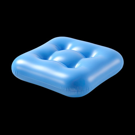 A vibrant blue inflatable cushion sits poised on a black background, creating a fun and inviting atmosphere for summer relaxation and leisure activities.の素材