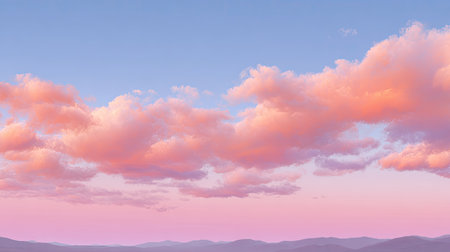 This stunning image captures a serene sunset with soft clouds illuminating the colorful sky over gentle hills, evoking tranquility and beauty in nature.の素材