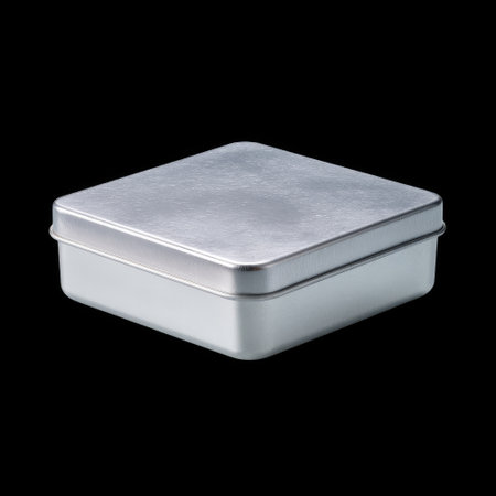 This minimalistic metal box features a smooth, shiny lid and a flat base, perfect for storage or packaging needs, isolated beautifully against a black backdrop.の素材