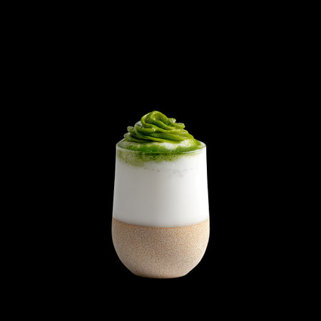 This elegant matcha green tea drink features a creamy whipped topping and smooth texture, perfect for a refreshing treat. Ideal for cafes or desserts.の素材