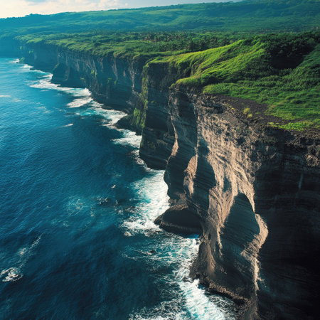 Scenic coastline from above showing cliffs, waves, and deep blue seaの素材