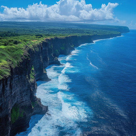 Scenic coastline from above showing cliffs, waves, and deep blue seaの素材