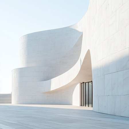 Curved white concrete facade of a contemporary museum with soft afternoon lightの素材
