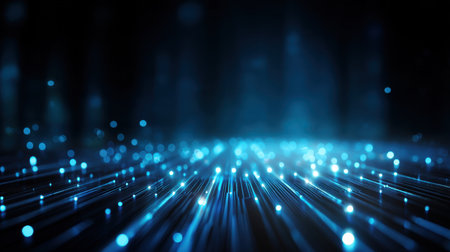 A stunning abstract representation of blue light particles glowing softly against a dark background, creating a mystical atmosphere perfect for technology designs.の素材