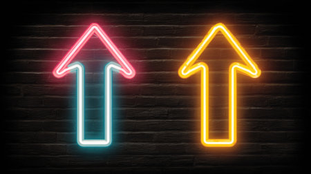Bright neon arrows in pink and yellow colors point upwards against a dark brick wall, perfect for modern design needs, signage, and creative projects emphasizing direction.の素材