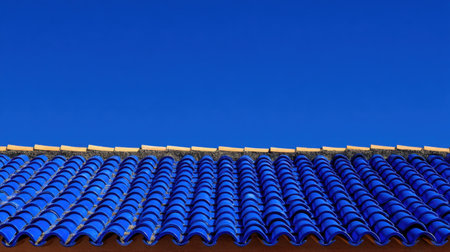 A stunning view of vibrant blue rooftops set against a clear sky. This image captures the intricate details of traditional tiles reflecting warmth and beauty.の素材