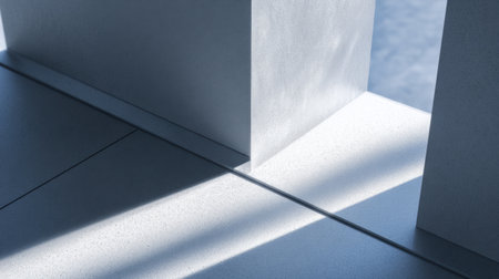 A captivating scene showcasing the interplay of light and shadow on sleek concrete surfaces, emphasizing minimalist design principles and geometric clarity in modern architecture.の素材
