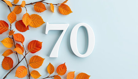 A striking composition featuring the number seventy in white surrounded by vibrant orange autumn leaves, set against a soothing light blue background.の素材