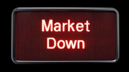 Bright red digital display board shows the message "Market Down" against a black background, highlighting the urgency of current market conditions.の素材