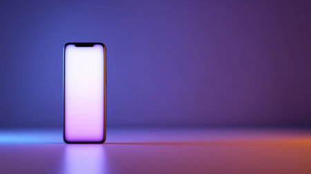 A sleek smartphone is positioned on a surface against a gradient background of purple and blue hues, emphasizing its modern design and potential for creativity.の素材
