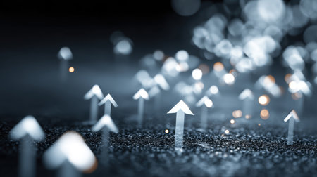 An abstract image showcasing upward arrows on a dark surface, symbolizing growth and progress in a modern business context with a blend of light and shadow.の素材