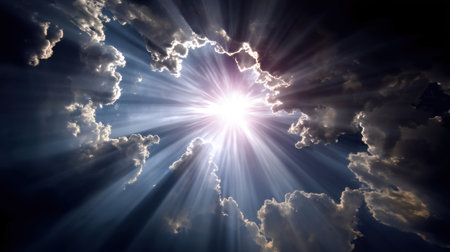 An awe-inspiring display of light as bright sun rays pierce through dramatic clouds, creating a breathtaking natural scene full of warmth and tranquility.の素材