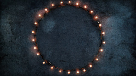 A captivating circular design featuring warm glowing lights set against a dark textured background, ideal for festive occasions, creative projects, and unique designs.の素材