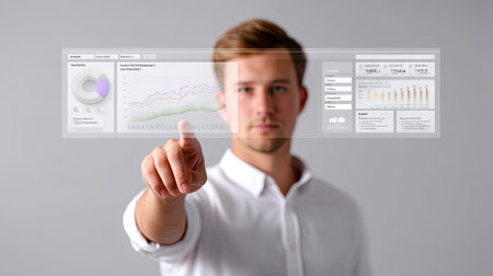 A businessperson interacting with digital interface, showcasing data analytics and performance metrics. individual appears focused and engaged, highlighting integration of technology modern businessの素材
