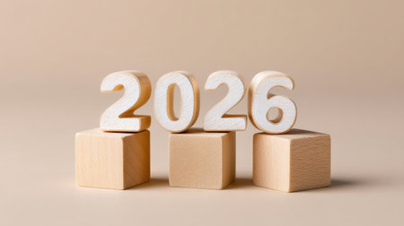 A wooden cubes forming year 2026, showcasing minimalist design on soft beige background, evoking sense of modernity and simplicityの素材