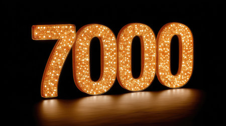 A bright glowing number 7000 illuminated with led lights, creating warm and inviting atmosphere. perfect for celebrations or decorative purposesの素材