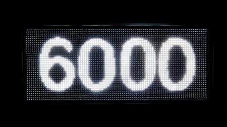 A closeup of glowing led display showing number 6000, highlighting its bright and modern design. digital format creates striking visual impact, perfect for various applicationsの素材
