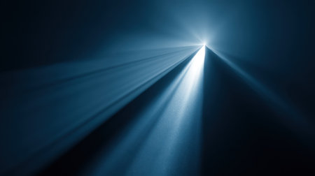 A captivating abstract image showcasing ethereal blue light rays piercing through darkness, ideal for evoking calmness and inspiration in creative projects.の素材