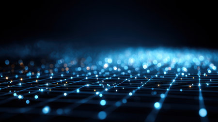 A mesmerizing digital landscape showcasing bright blue and orange particles on a dark backdrop. This image illustrates connectivity, technology, and innovation.の素材