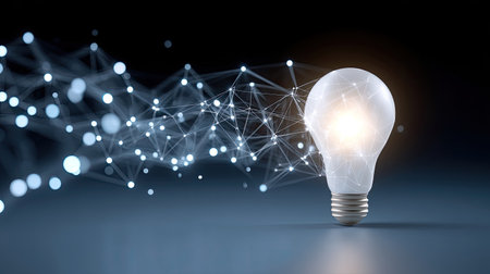 This image features a glowing light bulb symbolizing ideas and creativity, connected to an abstract digital network, representing innovation and technology.の素材