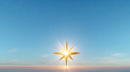 A stunning golden starburst shines brightly over tranquil ocean waters, set against a clear blue sky during sunset, creating a serene atmosphere.の素材