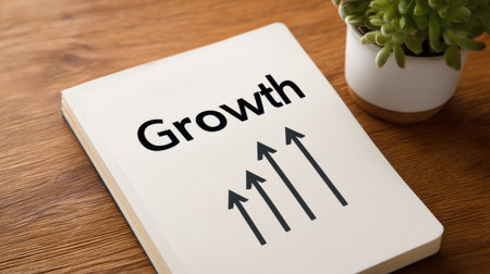 A stylish notebook featuring the word "Growth" alongside upward arrows, symbolizing positive development. Ideal for professionals, students, and creatives focused on progress and inspiration.の素材