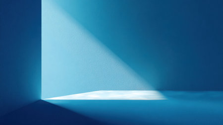 A tranquil scene featuring soft blue light spilling into a minimalist interior, creating contrasting shadows on textured walls, perfect for artistic concepts and designs.の素材