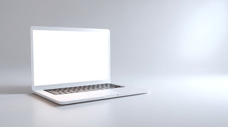 A sleek, white laptop sits against a minimalist background, featuring a blank screen. Ideal for showcasing design projects, digital presentations, and marketing concepts.の素材