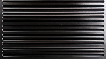 A sleek black surface featuring a linear pattern, ideal for backgrounds or graphic design use. This minimalist design adds elegance and modernity.の素材