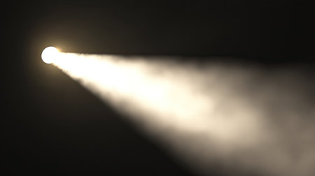 A striking light beam cutting through a dark and foggy space, creating an ethereal atmosphere. Ideal for themes of exploration, mystery, and creativity.の素材