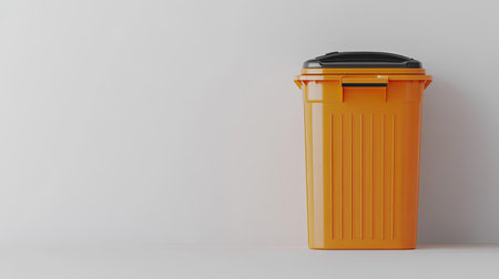 A vibrant orange trash can is placed against a white backdrop, highlighting its role in waste disposal and promoting eco-friendly practices in organized spaces.の素材