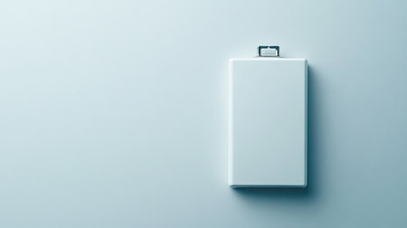 This image features a minimalist white clipboard resting against a soft blue background, ideal for showcasing documents or designs in a modern workspace setting.の素材