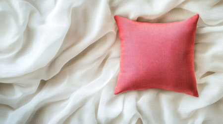 A cozy pink pillow rests on a soft white fabric, creating a tranquil and inviting atmosphere perfect for home decor inspiration and interior design ideas.の素材