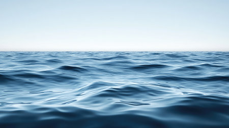 A serene and calm ocean view, showcasing gentle waves under a clear blue sky. This image embodies tranquility and invites viewers to escape into a peaceful natural environment.の素材