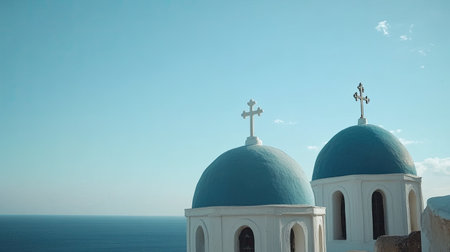 Stunning view of blue domed churches with crosses by the sea in Santorini. Captured in a peaceful moment, showcasing vibrant architecture and natural beauty.の素材
