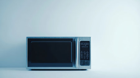 This image showcases a modern kitchen microwave in a minimalist setting. The sleek design and soft lighting highlight its functionality and aesthetic appeal.の素材