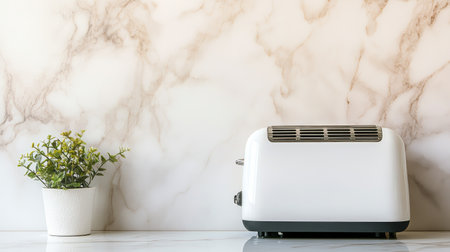 A modern kitchen scene featuring a sleek white toaster beside a small potted plant, set against a beautiful marble backdrop, creating a fresh and inviting atmosphere.の素材