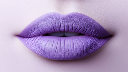 An artistic close-up image featuring vibrant purple lips on a smooth skin background, showcasing beauty and elegance in makeup and fashion artistry.の素材