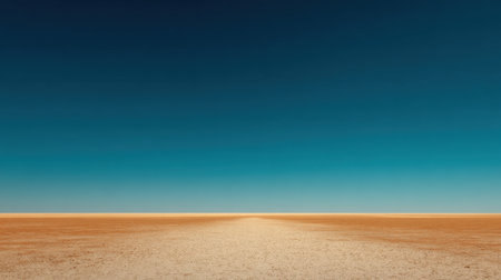 A serene and minimalist desert landscape featuring a vast horizon under a clear blue sky, inviting viewers to experience solitude and natural beauty in an expansive setting.の素材