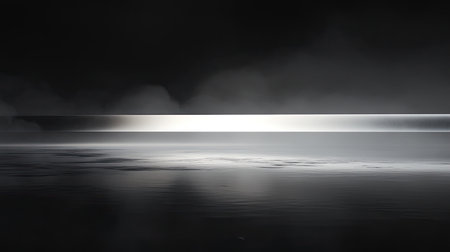 A captivating black and white landscape featuring calm water with a misty horizon, evoking feelings of tranquility and serenity in a minimalistic style.の素材