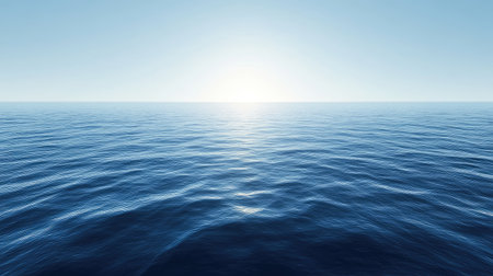 This stunning image captures a calm ocean with gentle waves under a bright morning sky. The tranquil scene evokes feelings of peace and serenity.の素材