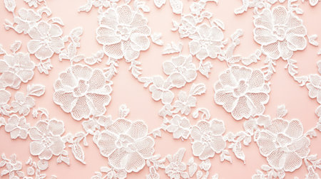 This image features a delicate white lace floral pattern set against a soft pink background, perfect for textiles, crafts, and elegant design projects.の素材