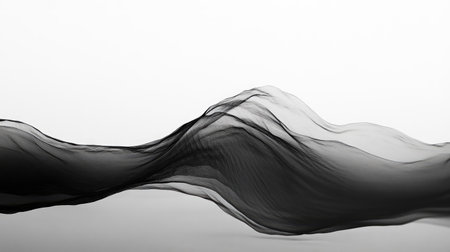 This abstract image features flowing black fabric creating elegant wave shapes. The smooth texture and minimalistic design evoke a sense of motion and beauty.の素材