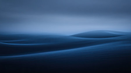A serene view of gentle blue waves undulating across a tranquil landscape at dusk. This minimalist image captures the calm essence of nature's beauty, evoking a sense of peacefulness and depth.の素材