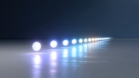 A serene arrangement of softly glowing spheres positioned on a reflective surface, showcasing subtle blue and white light effects, creating a tranquil atmosphere.の素材