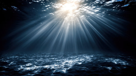 Dive into this stunning underwater scene featuring soft rays of sunlight breaking through the calm ocean surface, illuminating the serene depths below.の素材