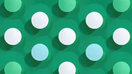 Graphic pattern featuring symmetrical flat circles placed on dynamic triangular design, clean area left blankの素材